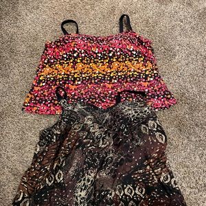 Swim tank tops only. 2 included. Built in bras